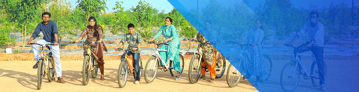 Guests enjoying thrilling cycling adventure surrounded by sandalwood farms at go ranch