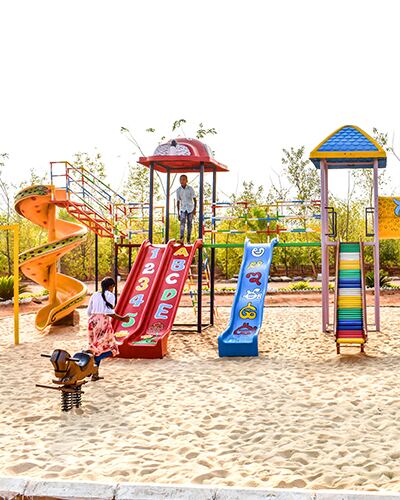 Fun-filled kids play area with colorful slides at Go Ranch Resort